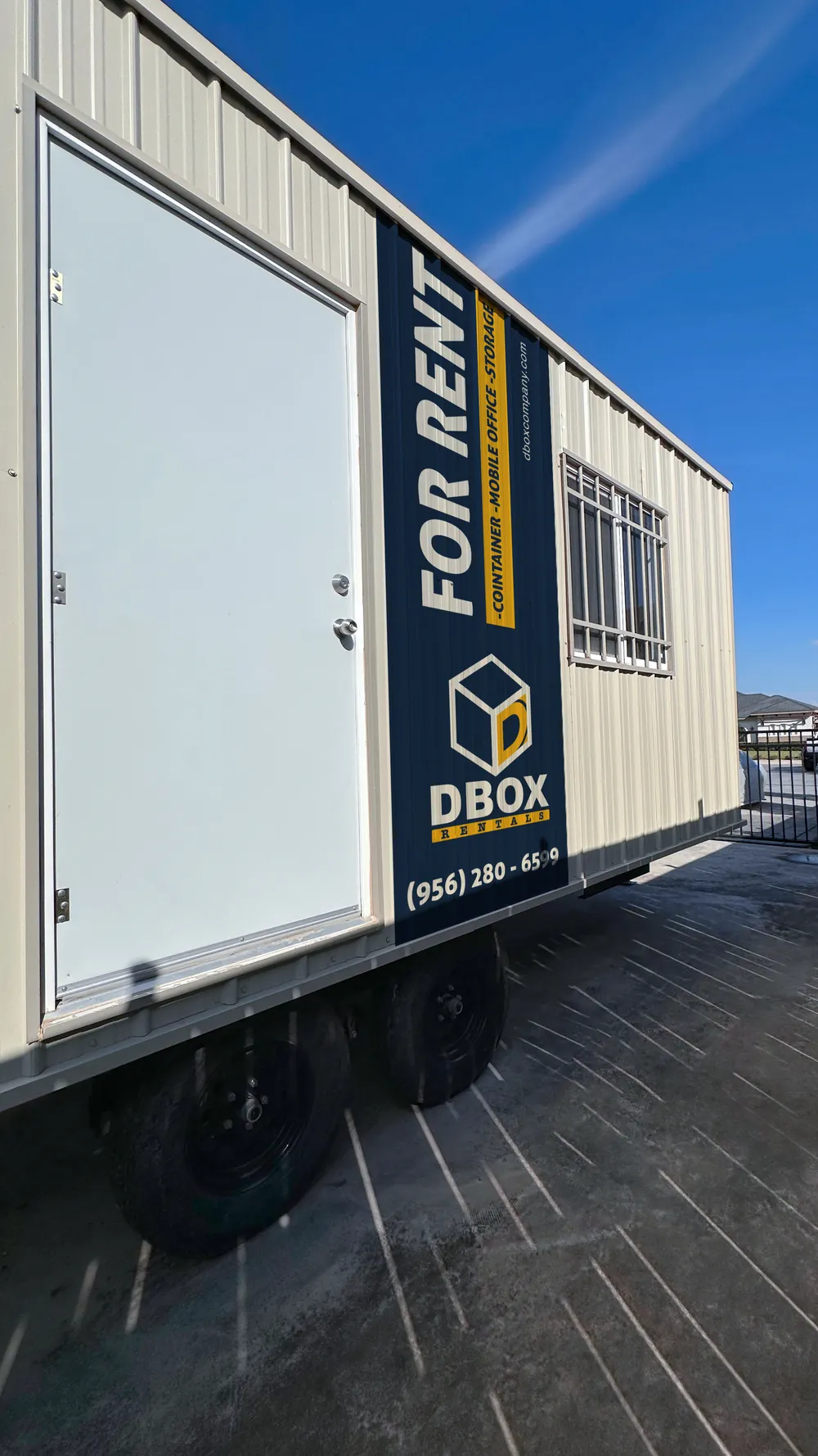 A DBOX Rentals mobile office unit on a trailer, ready for delivery